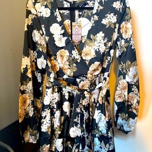 Black romper with flowers on it